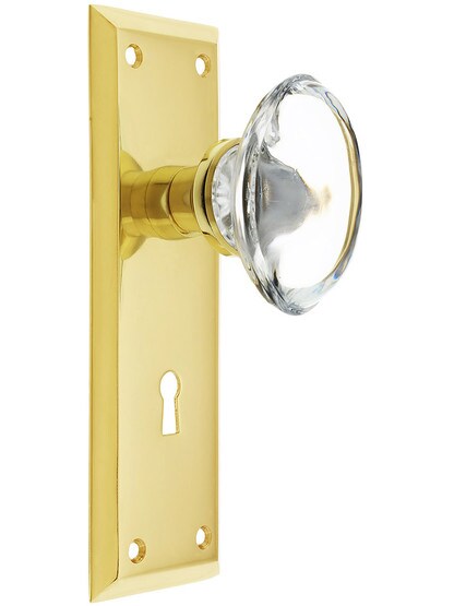 New York Plate with Oval Clear Crystal Knobs with Keyhole in Polished Brass.
